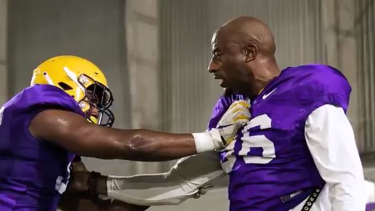 LSU's D-line coach puts the pads on during practice (andre carter)