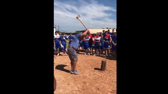 Video: Coach grabs team's attention for a lesson using an axe, a chunk of wood, and a few big swings (high school)