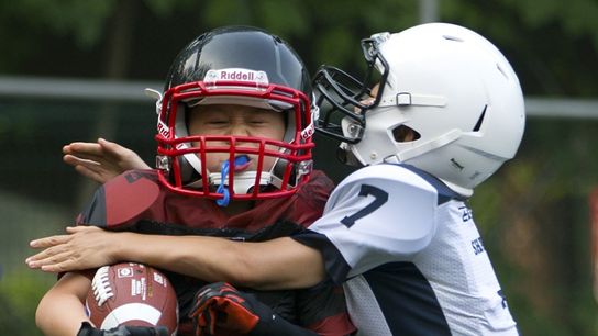 Researchers take stand against proposed youth tackle football ban stating "a cause-and-effect relationship has not yet been demonstrated between CTE and contact sports." (Featured)