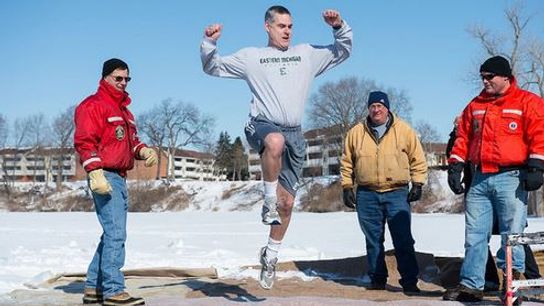 Video: Eastern Michigan coaches and players take the polar plunge