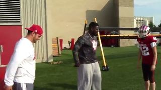 Female reporter learns the art of tackling from a Hoosier player (video)