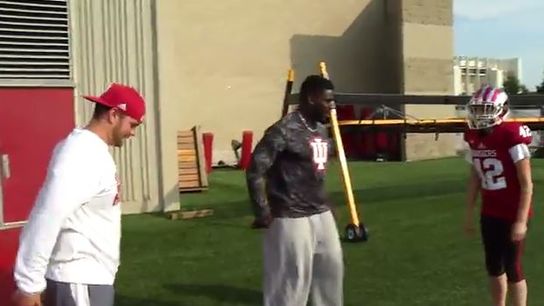 Female reporter learns the art of tackling from a Hoosier player (video)