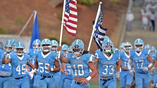 California school system halts football team carrying police flag, dividing community (Police)
