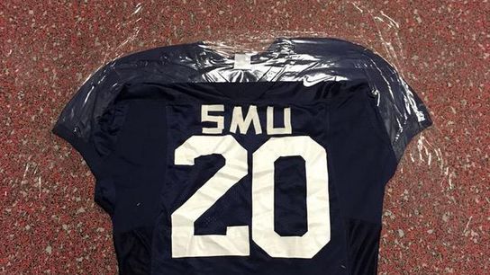 Tom Herman and his staff have taped SMU jerseys to the floor around the facility