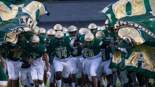 Florida has suspended a high school coach for taking kids on college visit and buying cleats for another (Florida)
